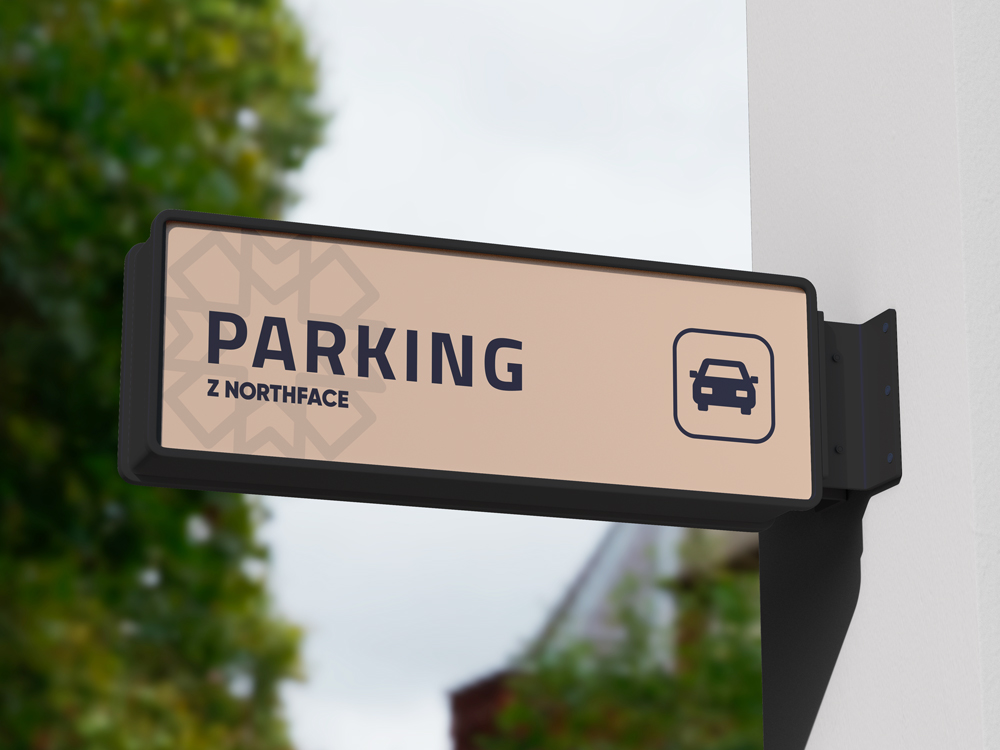 Z Northface exterior parking signage — bold display type on a Rodeo Dust signboard with the pattern subtly tessellated behind
